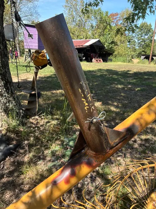 Welded metal pipe and equipment frame outdoors at a rural property